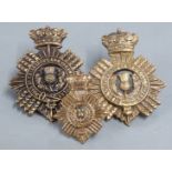 Three Duke of Edinburgh Own Volunteer Rifles metal badges