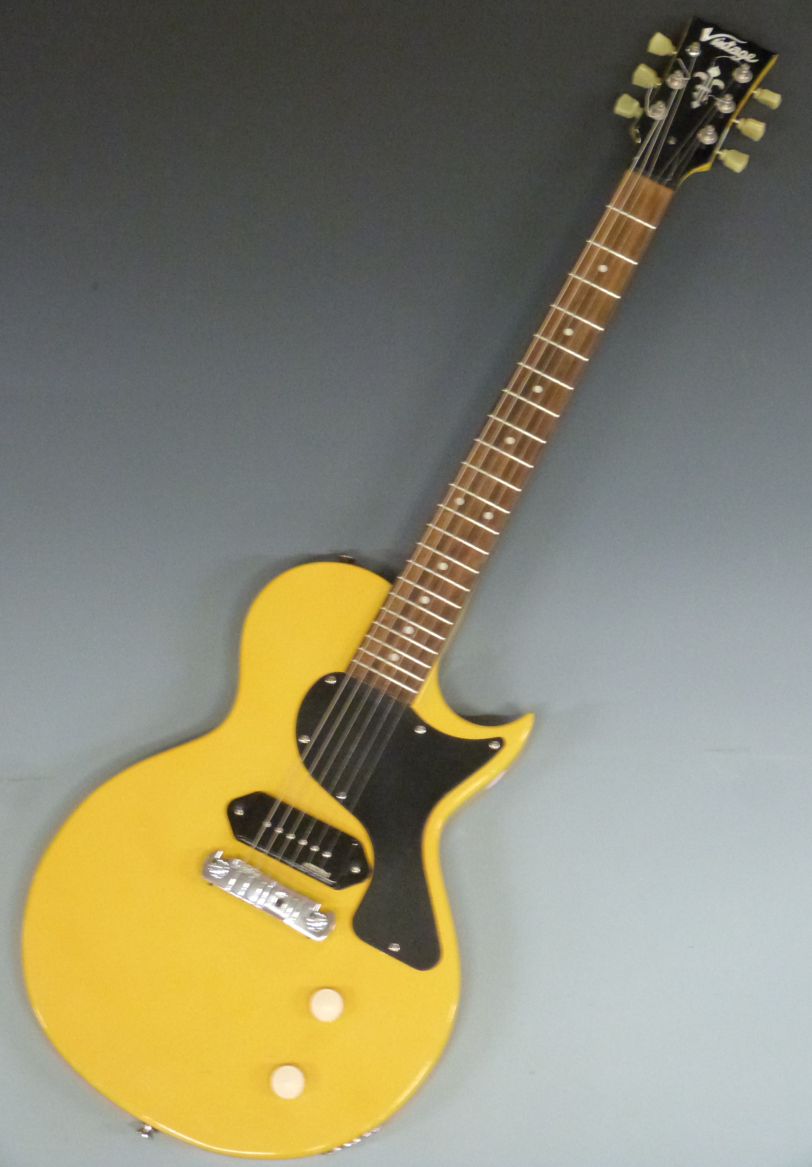 Electric guitar in yellow lacquered finish by Vintage, Wilkinson pick-up