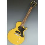 Electric guitar in yellow lacquered finish by Vintage, Wilkinson pick-up