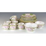 A collection of Minton dinner and tea ware with enamelled decoration