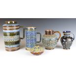 Four pieces of Doulton Lambeth comprising four jugs and a squat vase, two signed by Henrietta
