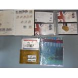 A quantity of empty albums, reference books and Olympic first day covers