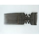 African tribal carved comb, Zanzibar probably first quarter 20thC, H26cm