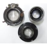 Three camera or similar lenses comprising Schneider Kreuznach 1:5.6/150 Componon, Zeiss Tessar 1:4.5