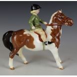 Beswick girl on a skewbald pony, H14.5cm