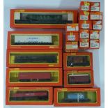 Twenty-one Tri-ang Hornby 00 gauge model railway wagons, tankers and vans including London Brick,