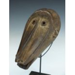 African tribal Baule carved baboon mask on bespoke stand, height on stand 39cm