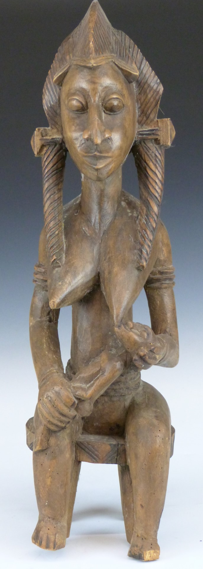 African tribal Bamana carved fertility/ maternity figure of a seated mother feeding her child,