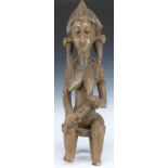 African tribal Bamana carved fertility/ maternity figure of a seated mother feeding her child,