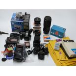 Cameras and accessories including Canon A1 SLR with 50mm 1:1.8 lens, Tamron 17mm 1:3.5, Tokina 70-