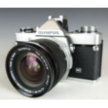 Olympus OM-1n SLR camera with 21mm 1:2 lens