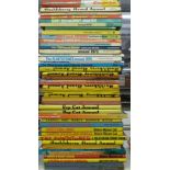 Forty-two film and TV related cartoon books and annuals including Laurel & Hardy, Huckleberry Hound,