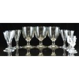 Ten 18th/19thC clear glass drinking glasses, including a set of three and a set of five, largest