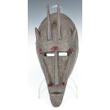 African tribal carved and horned Marka mask with beaten metal decoration, H34cm. Provenance:- part