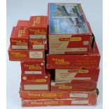 A collection of Tri-ang 00 gauge model railway buildings and accessories including Operating