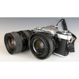 Fujica AX-5 SLR camera with 50mm 1:1.6 lens, together with a Tamron SP 35-80mm 1:2.8-3.8 lens with