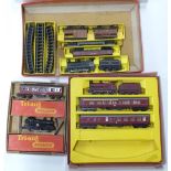 Three Tri-ang 00 gauge model railway train sets.