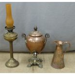 Art Nouveau copper jug, samovar and a brass oil lamp, H66cm