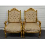 A pair of upholstered continental style giltwood chairs raised on reeded turned and stepped legs,