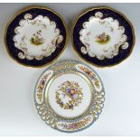 Three Coalport cabinet plates including a reticulated example with relief, enamelled and gilt