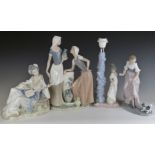 Three large Nao figures comprising a pair of water carriers, girl with puppy and Japanese