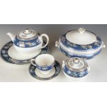 Thirty three pieces of Wedgwood dinner and tea ware decorated in the Blue Siam pattern, six place