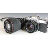 Canon AV-1 SLR camera with 50mm 1:1.8 lens and a Tokina 70-210mm 1:4-5.6 lens