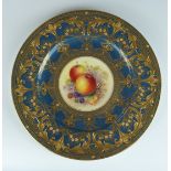 Royal Worcester cabinet plate with painted fruit decoration within a gilded surround, signed W