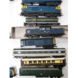 Over forty Tri-ang and Hornby 00 gauge model railway locomotives together with various loose bodies.