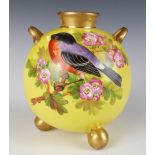 Royal Worcester porcelain twin handled vase with bird decoration, raised on ball feet, H8.5cm