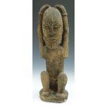 African tribal Yoruba carved figure of a man with hands on head, H39cm