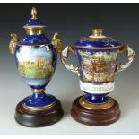 Two limited edition covered pedestal commemorative urns by Aynsley and Caverswell, exclusive to