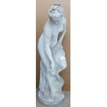 A stone garden statue of a semi nude maiden in the classical style, H84cm