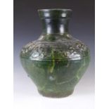 Chinese Han dynasty green glazed terracotta pottery vase decorated with a frieze of animals, with