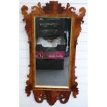 A mahogany bevelled glass wheatear mirror with crossbanded rosewood and gilt decoration, 124x63cm