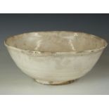 Chinese Han dynasty ribbed pedestal bowl with cream glaze