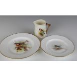 Royal Worcester porcelain plates and jug, all with decoration of garden birds including a