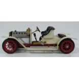 Mamod SA1 live steam roadster car with cream body and wings.