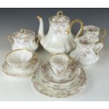 An extensive Limoges tea set including teapot, jugs etc and two Royal Worcester boxed sets of tea