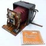 Sanderson Junior plate camera with red bellows, fitted with Goerz f=150mm 1:6,8 lens,