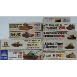 Nine 1:35 and 1:48 scale plastic model tank kits comprising two Italaeri, two Tamiya, four Bandai