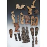 A collection of carved wooden figures of Eastern and African origin, tallest 28cm