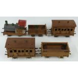 Meccano or Butcher & Sons Primus model of a train comprising locomotive, two coaches and two wagons,