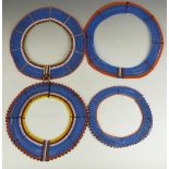Four African tribal Masai beaded necklaces possibly to be worn together, largest diameter 37cm