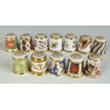 A collection of Royal Crown Derby thimbles including Imari examples