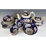 An early 19thC tea set, hand decorated with flowers in the Gaudy Welsh style, probably Rockingham,