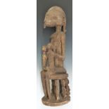 African tribal Dogon carved maternity figure of a mother suckling two infants raised on figural