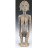 African tribal Bamana carved fertility / maternity figure resting on a stool, H49cm