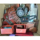 A collection of Meccano or similar parts including vehicle cabs.