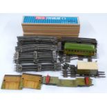 A collection of 0 gauge model railway rolling stock, accessories and track including Lionel